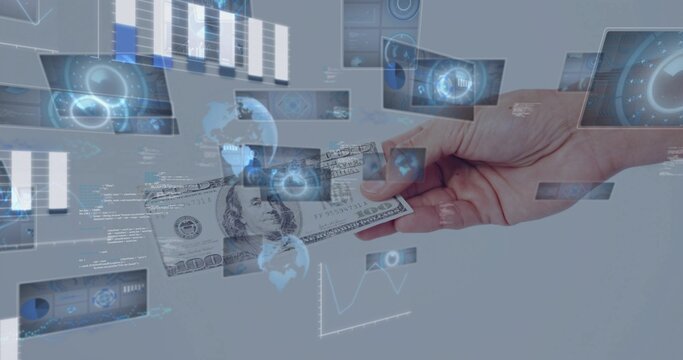 Holding US $100 bill, right hand with bare wrist offering amid studio HUD panels and graphs