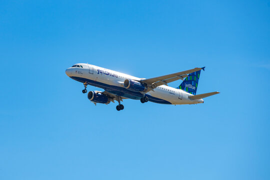 JetBlue Airbus 320-200 N591JB "Take of Blue Cities" landing on Boston Logan International Airport, Boston, Massachusetts MA, USA. 