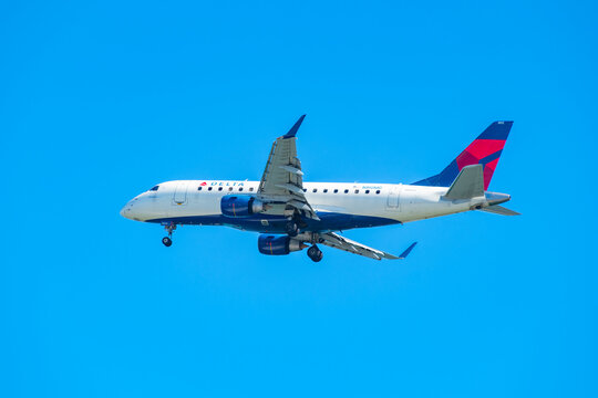Delta Air Lines Connection Embraer ERJ-175 N213JQ landing on Boston Logan International Airport, Boston, Massachusetts MA, USA.