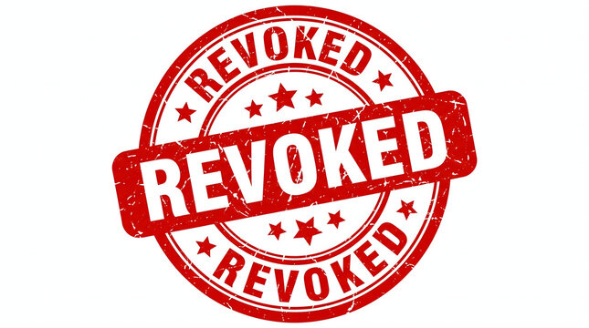 A red stamp with the word Revoked on a white background