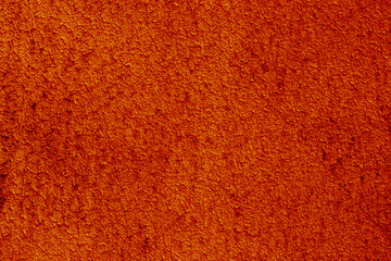 Rich orange carpet texture with soft, plush fibers © gelog67