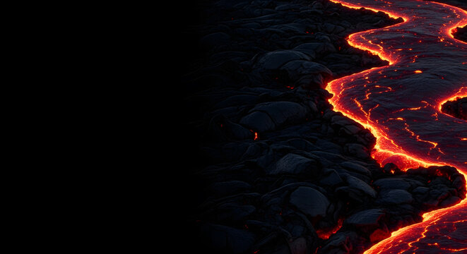 Molten Lava Flow on Black Rock. Close-up of glowing orange lava flowing through dark volcanic basalt, with a large black copy space area on the left side.