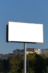 Fototapeta premium Advertising billboard along the road in the city. Background for design. 