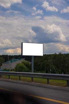 Advertising billboard along the road in the city. Background for design. 