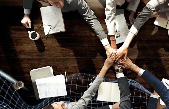 Business people are joining hands together