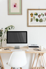 Fototapeta premium Minimalist workspace with botanical art, suitable as mockup