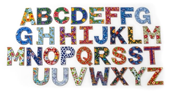 A colorful and vibrant alphabet display with floral patterned letters on a white background