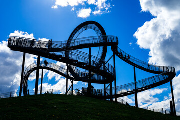 A silhouette of a popular observation deck in Duisburg on the Rhine (Germany), featuring a few...