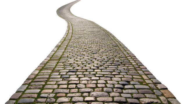 Isolated winding cobblestone road with green grass growing between stones leading into distance