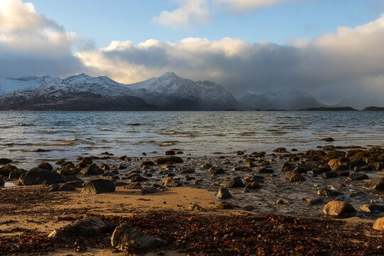 Coast with stones and  stunning fjord scenery in Skaland on the remote North Norwegian Island of Senja