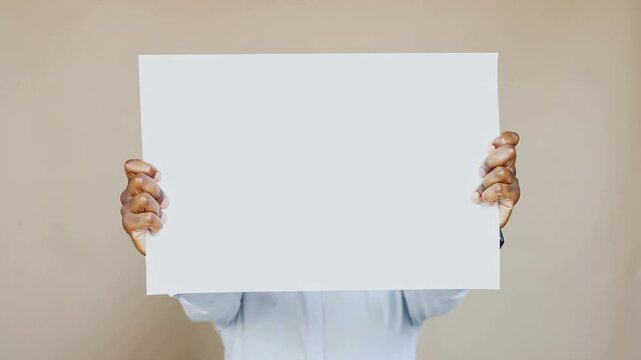 Protester holding blank sign in city, freedom of speech and peaceful activism concept.