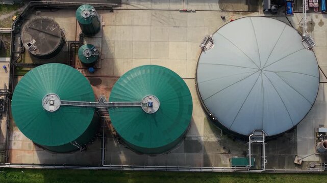 Top down aerial view of busy industrial activity and vehicle movement at a biogas renewable energy site in the UK