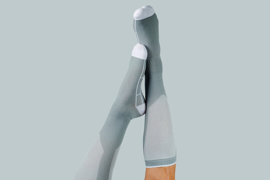 crossed legs upside down in compression socks