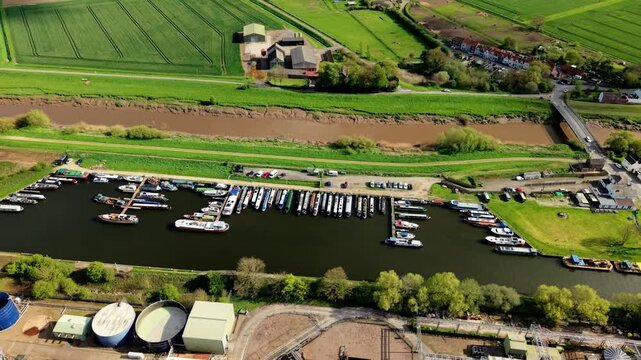 Close up aerial view of yachts and narrowboats docked in a marina near Rawcliffe Bridge UK