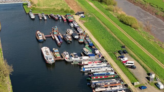 Close up aerial view of yachts and narrowboats docked in a marina near Rawcliffe Bridge UK