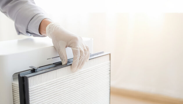 Technical maintenance modern skilled trades worker hand adjusting air purifier filter panel with glove care and focus on clean indoor air quality