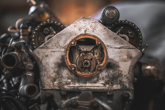 Close-up of a weathered and complex internal combustion engine part