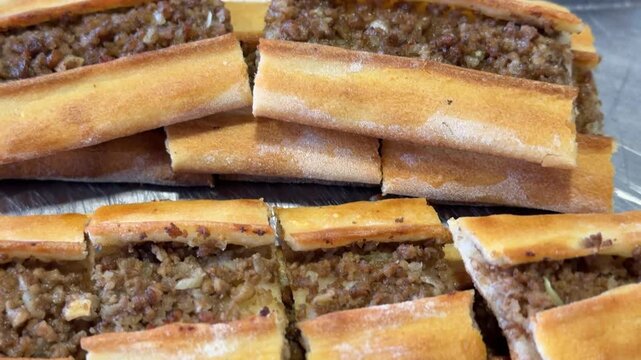 Turkish pide with minced meat filling, traditional flatbread dish, top view, food background