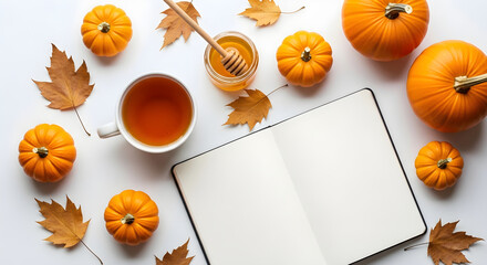 Fototapeta premium Happy halloween pumpkin spice festive autumn flatlay with pumpkins leaves tea and blank journal