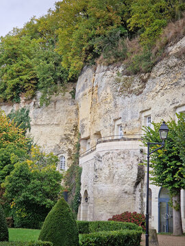 Rochecorbon, France - October 24, 2025: Les Hautes Roches troglodyte dwellings carved directly into a limestone cliff. Unique hotel with luxury rooms cut into the rocks