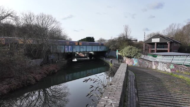 Birmingham, England - February 14, 2026: A pair of Bombardier Transportation built class 172 Turbostar diesel multiple units cross the Grand Union Canal near Tyseley.