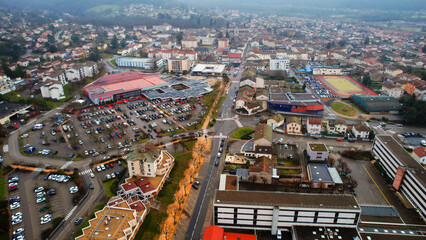 Obraz premium Aerial view around the city Ambérieu-en-Bugey in France on a low cloud afternoon in late winter.