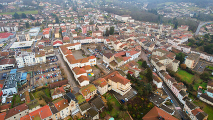 Fototapeta premium Aerial view around the city Ambérieu-en-Bugey in France on a low cloud afternoon in late winter.