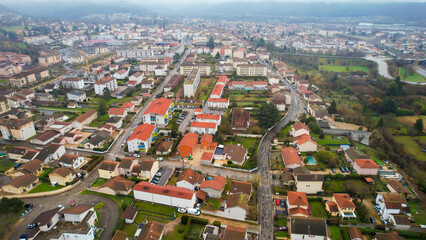 Obraz premium Aerial view around the city Ambérieu-en-Bugey in France on a low cloud afternoon in late winter.