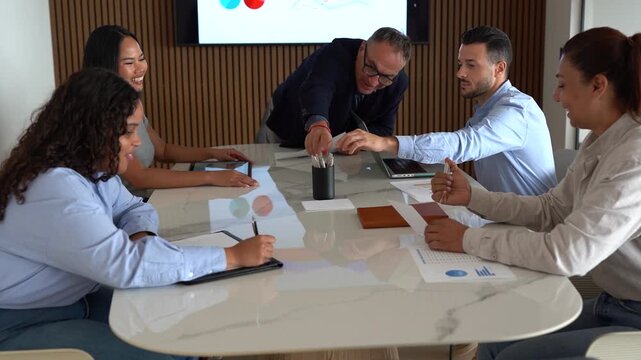 Multi generational business people sharing ideas during team meeting inside modern office - Multiracial colleagues, entrepreneur and corporate concept