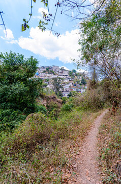 Landscape of informal housing on steep hills under conditions of economic vulnerability.
