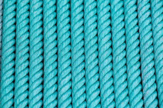 Aqua rope winding creating textured pattern background
