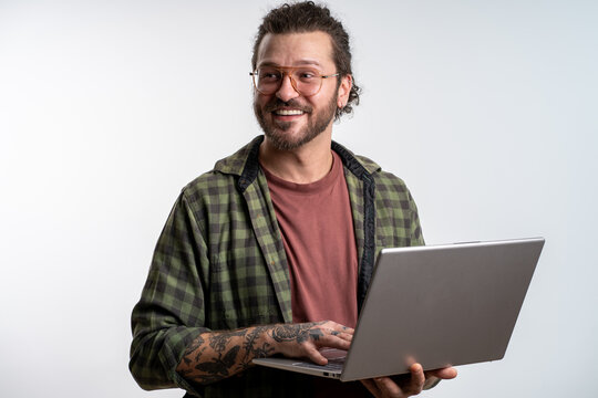 Freelancer coder using laptop on isolated white background portrait