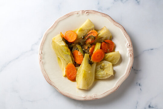 Traditional Turkish Braised Fennel (Rezene) with Carrots and Olive Oil on a Vintage Plate