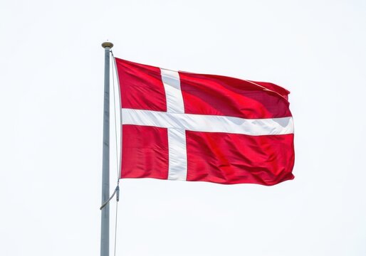 Flag of denmark waving on a flagpole national symbol of denmark, red field with a white nordic cross, dannebrog