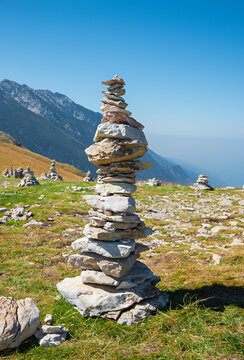 big rock cairn of rough stones at Monte Baldo mountain, italy