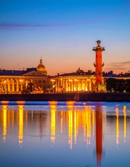 Obraz premium Cityscape at dusk. Illuminated architecture with tall column by serene water, reflecting lights of buildings & sky. Warm hues & cool colors