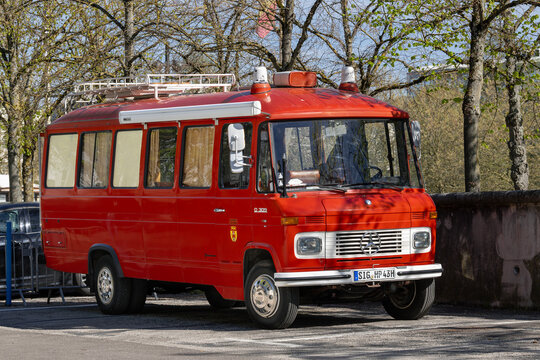 Nancy, France - April 9th 2026 : View on a red Mercedes-Benz O 309 converted into a camper van parked on a parking lot.