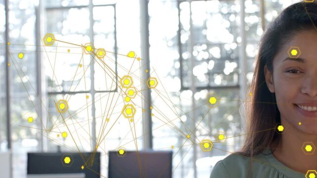 Woman watching yellow network drifting over windows, visualizing technology data, causing smile
