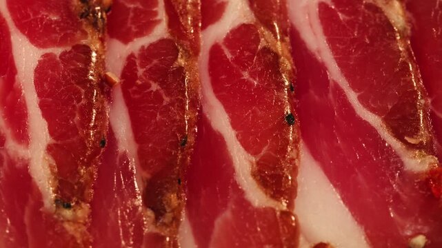  Sliced ham jamon fat bacon meat, beef pastrami thick pieces on a wooden board, beef or pork jamon. Chef cooking breakfast, smoked bacon in cafe. 