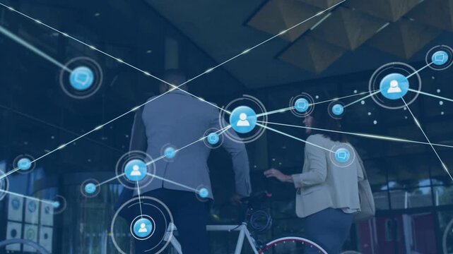 Colleagues walking into lobby while single node appearing, branching into web showing connections