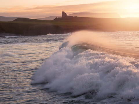 Castle Classiebawn viewpoint and stunning rough Irish stone coastline at sunset. Popular tourist area with amazing nature scenery. County Sligo, Ireland. Travel and tourism landmark.