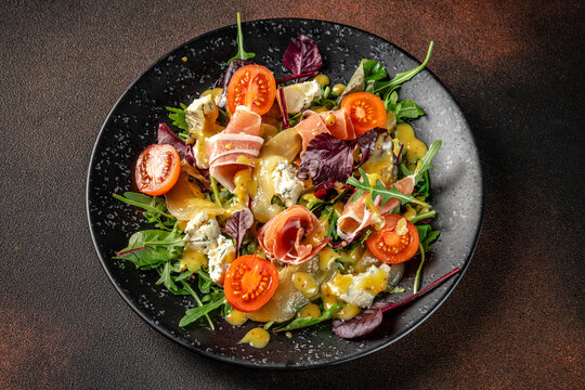 Top view gourmet salad with prosciutto and cheese