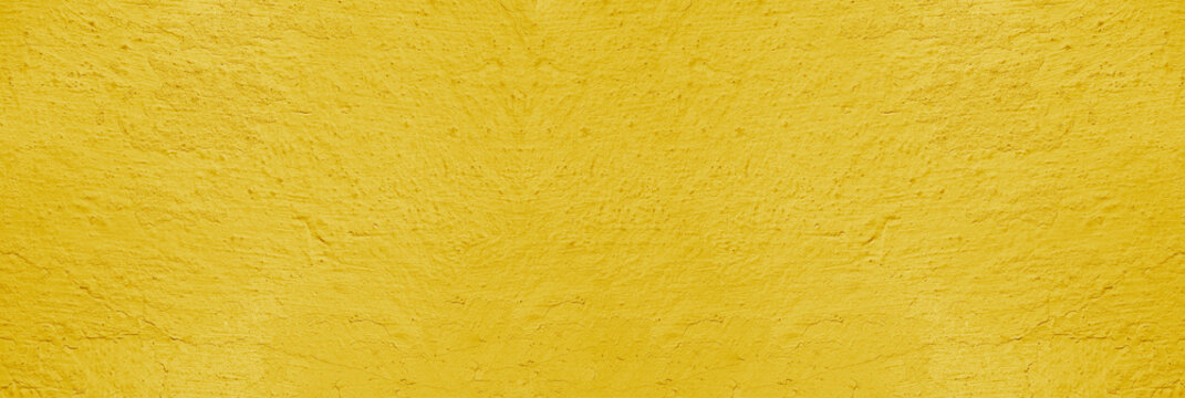 Background of natural yellow gold golden stucco in plaster cement texture lined pattern or stone in colors aged Textured illuminated wall fence surface blend of warm sunny tones backdrop.