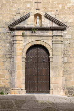 Door with decorative portal to Church of Santa Maria la Mayor on Duquesa de Parcent Square, Ronda, Spain, Andalusia