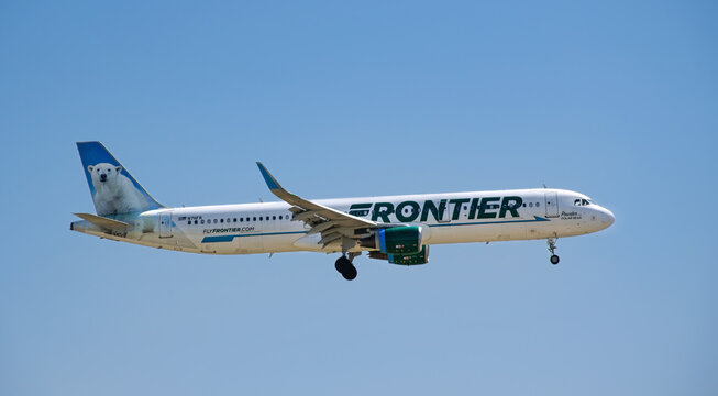 Frontier Airlines aircraft Airbus A321-200 airborne over Dallas Fort Worth International Airport (DFW). Powder the Polar Bear livery.
