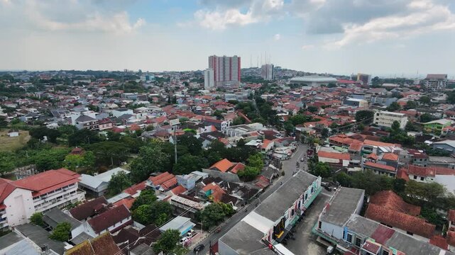 Aerial Drone View of Dense Urban Residential Neighborhood and Cityscape in Indonesia.