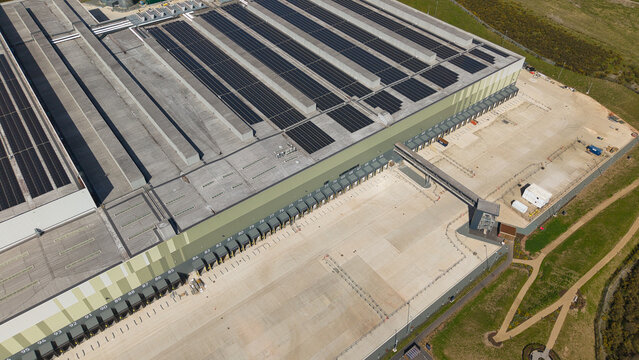Aerial view of the supermarket distribution centre with solar panels on the roof and numerous loading bays in Nailstone, Nuneaton, United Kingdom.