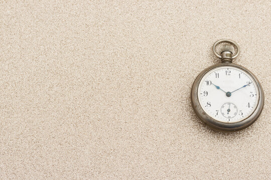 Pocket watch background on gold glitter texture