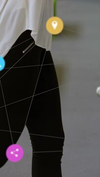 Vertical video: Woman walking treadmill, pressing console and starting UI icons tracking workout