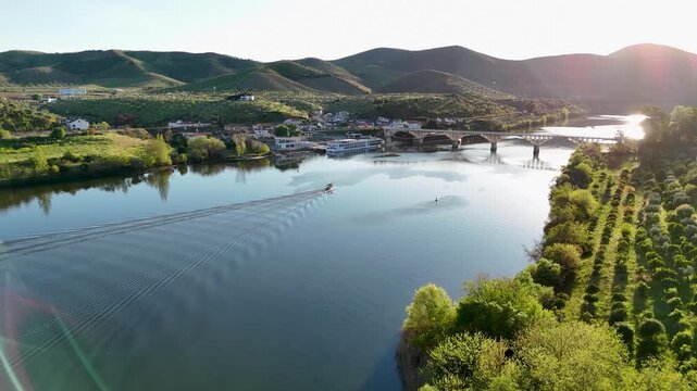 Aerial view of a motorboat cruising on the douro river